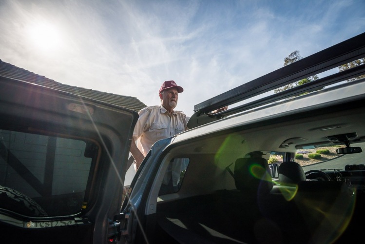 Scott's dad bolts on the new roof rack