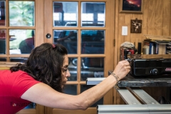 CrtrGrl measures the fit of the stove on the stove tray