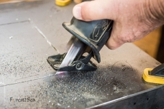 My dad cutting out extra metal from the fridge and stove sliding