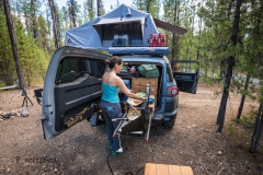 CrtrGrl making dinner using our camp kitchen, while dispersed ca